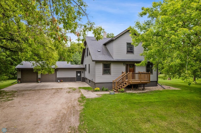 view of front of house featuring a garage and a front yard