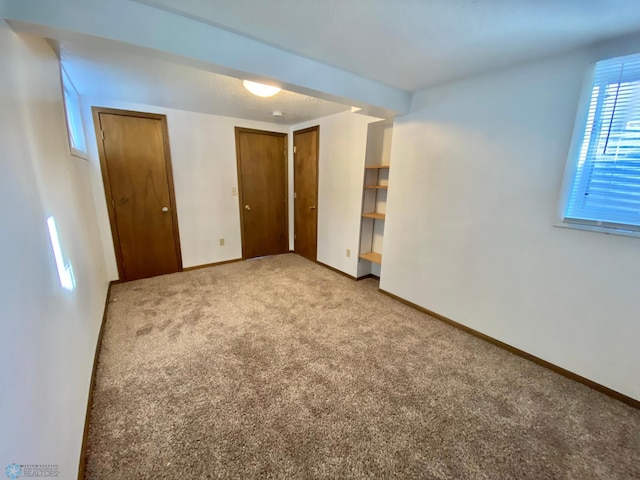 unfurnished bedroom with carpet