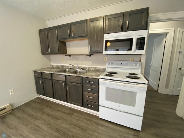 kitchen with dark brown cabinets, sink, white appliances, and dark wood-type flooring