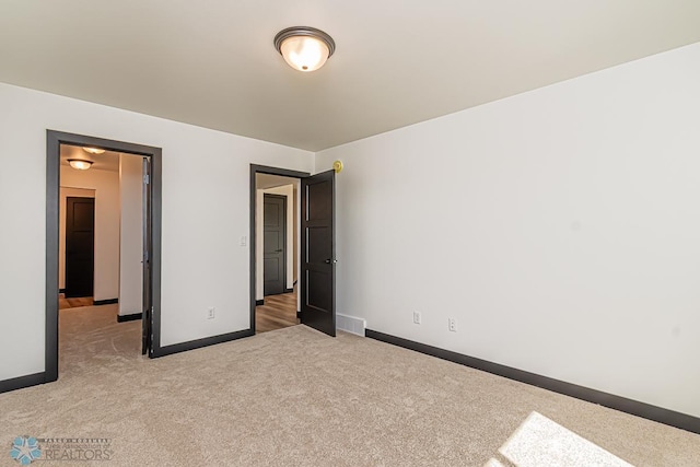 unfurnished bedroom featuring carpet