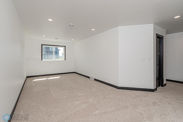 unfurnished room with carpet floors