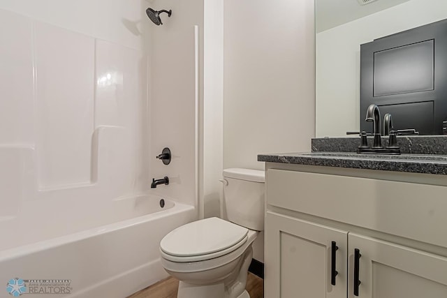 full bathroom featuring shower / tub combination, vanity, toilet, and hardwood / wood-style floors