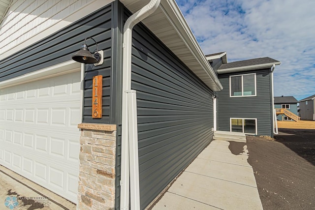 view of property exterior with a garage