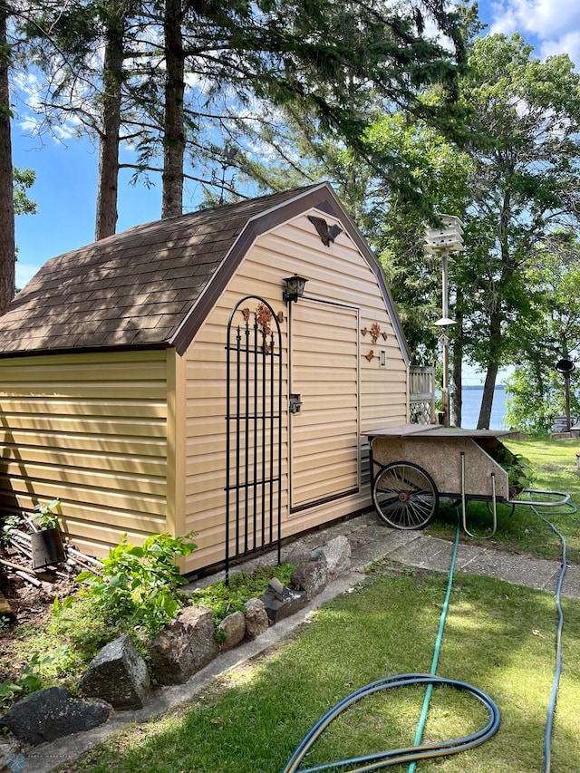 view of outbuilding with a lawn