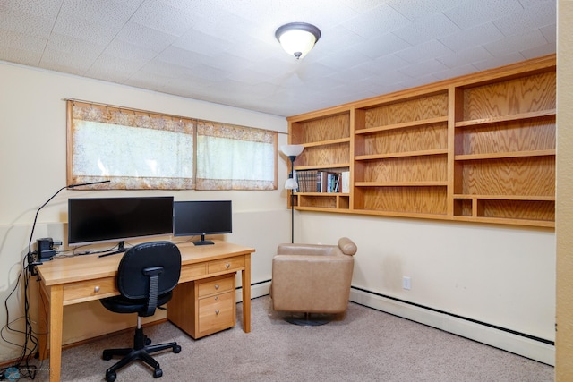 carpeted office space with a baseboard radiator