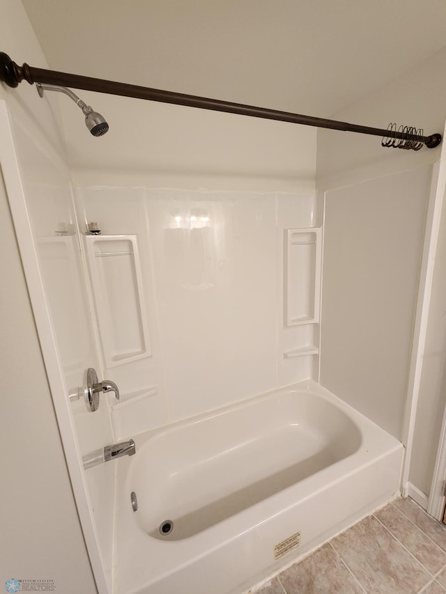 bathroom featuring bathtub / shower combination and tile patterned floors