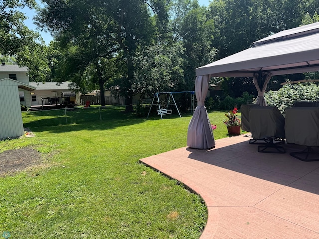 view of yard featuring a gazebo and a patio area