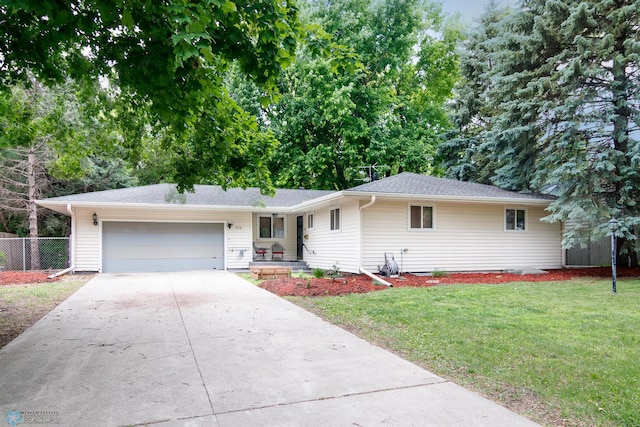 ranch-style house with a garage and a front yard