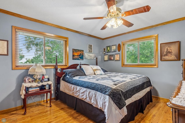 bedroom featuring ornamental molding, ceiling fan, and light wood-type flooring