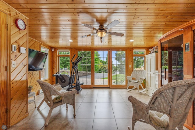 interior space with ceiling fan, wooden ceiling, and plenty of natural light