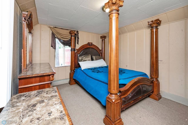 carpeted bedroom featuring baseboard heating