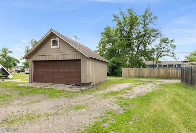 garage featuring a yard