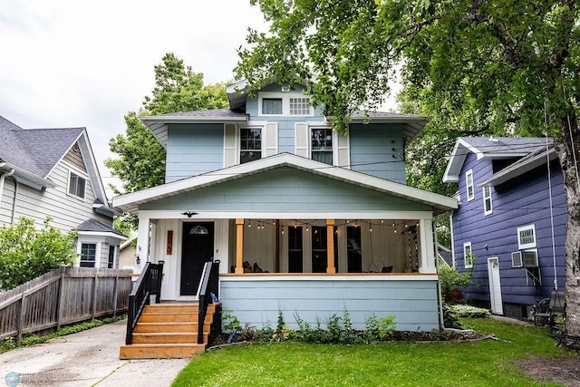 view of front of house featuring a porch and a front yard