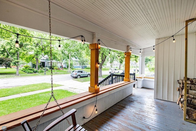 wooden deck with a lawn