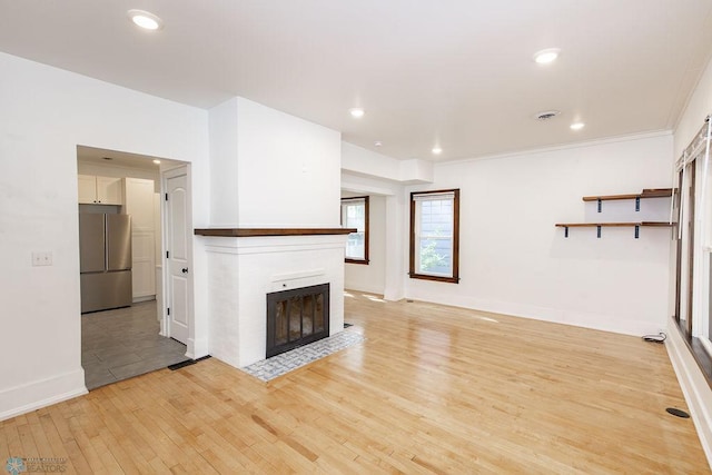 unfurnished living room featuring light hardwood / wood-style floors