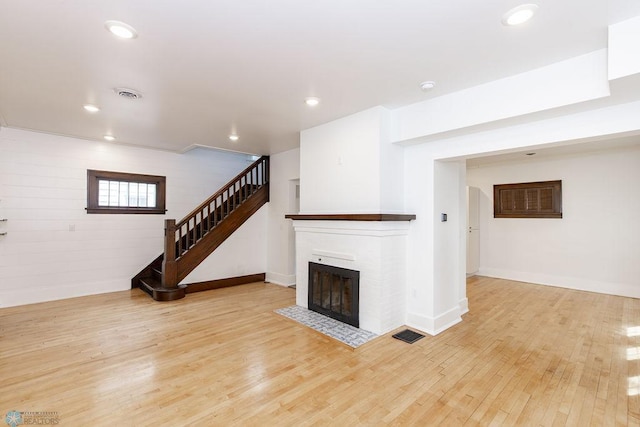 unfurnished living room featuring light wood-type flooring