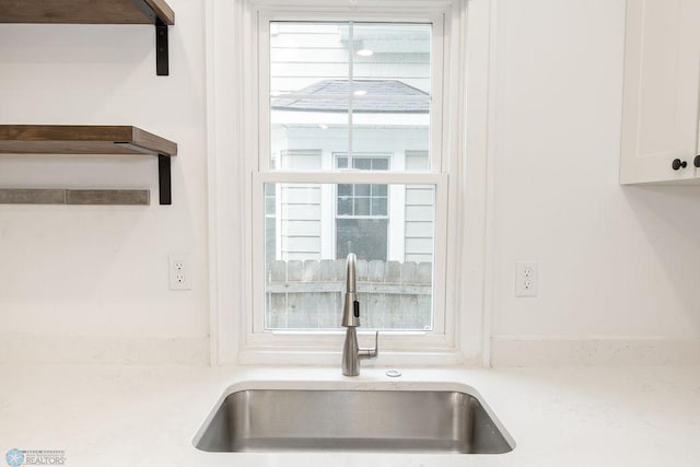 kitchen with sink and white cabinets