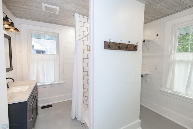 bathroom with vanity, concrete flooring, shower / tub combo, and wood ceiling