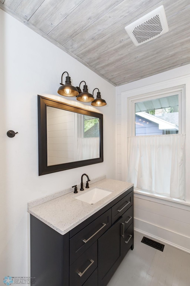 bathroom with vanity and wooden ceiling