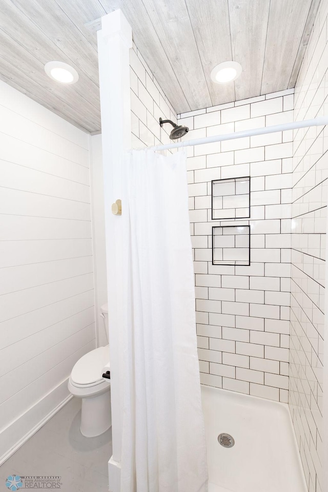 bathroom with toilet, wooden ceiling, and walk in shower