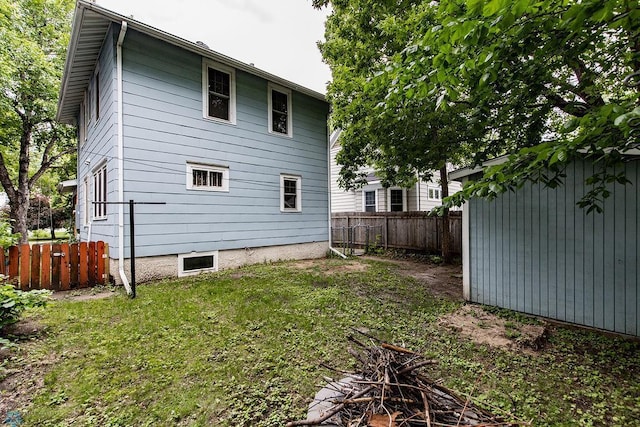 rear view of property with a lawn