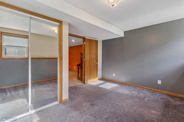 unfurnished bedroom with carpet floors and a closet