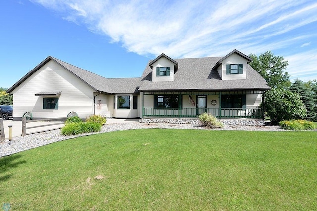 new england style home featuring a porch and a front lawn