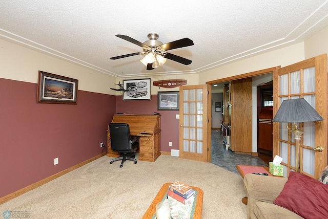 home office with carpet flooring, a textured ceiling, and ceiling fan