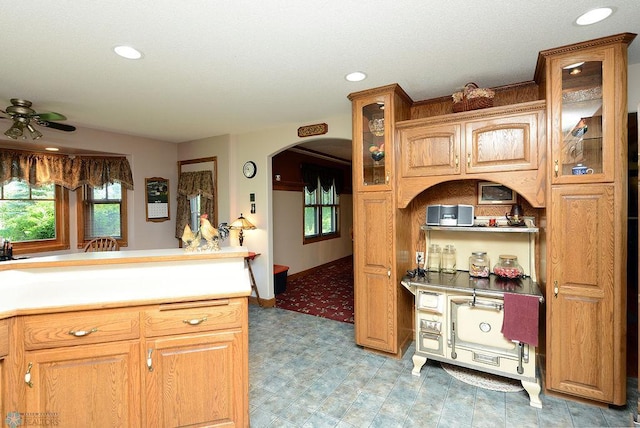 kitchen with ceiling fan and tile patterned flooring