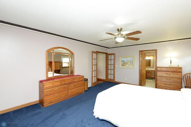 bedroom featuring ensuite bathroom, dark carpet, french doors, crown molding, and ceiling fan