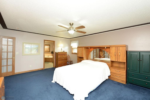 bedroom with multiple windows, ensuite bath, ceiling fan, and dark carpet