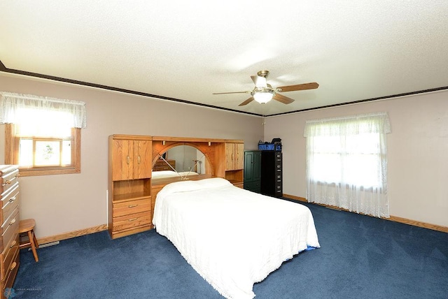 carpeted bedroom featuring multiple windows, ornamental molding, and ceiling fan