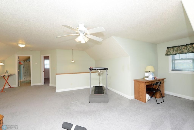 interior space featuring plenty of natural light, a textured ceiling, ceiling fan, and lofted ceiling