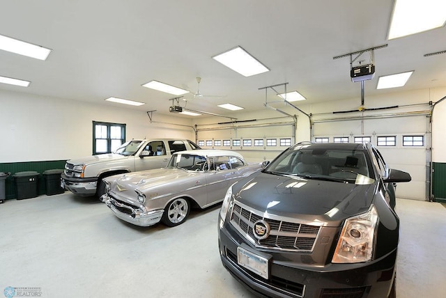 garage featuring a garage door opener and ceiling fan