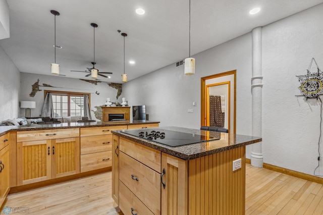 kitchen featuring a kitchen island, pendant lighting, ceiling fan, and light hardwood / wood-style flooring