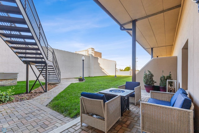 view of patio / terrace featuring an outdoor living space with a fire pit and a pergola