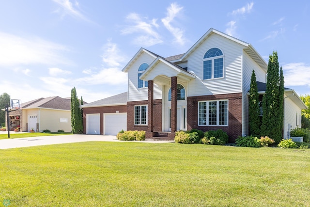 view of front of house featuring central air condition unit, a garage, and a front yard