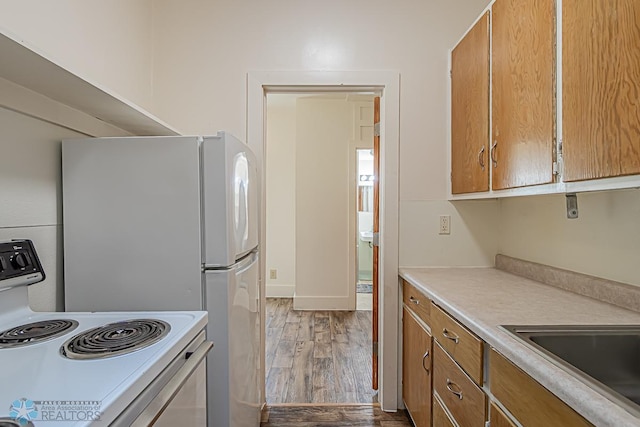 kitchen featuring hardwood / wood-style floors and white range