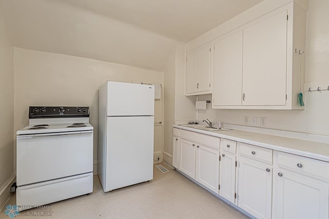 kitchen featuring sink, white cabinetry, and white appliances