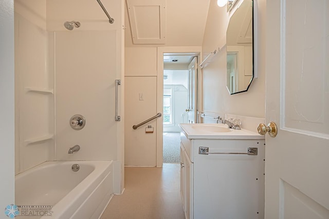 bathroom featuring washtub / shower combination and vanity