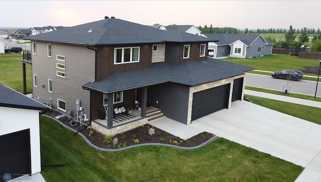 view of front facade with a garage and a front lawn