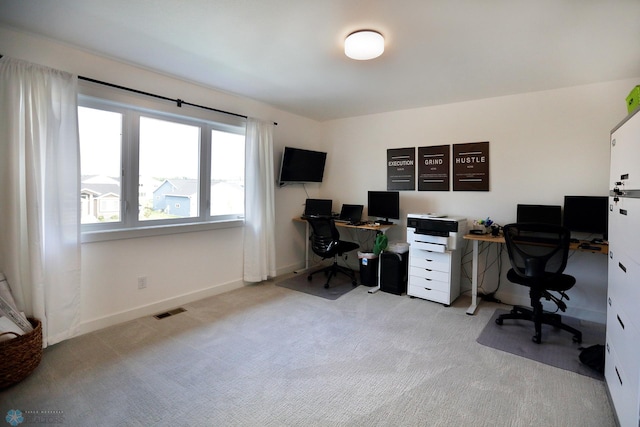 office space with light colored carpet