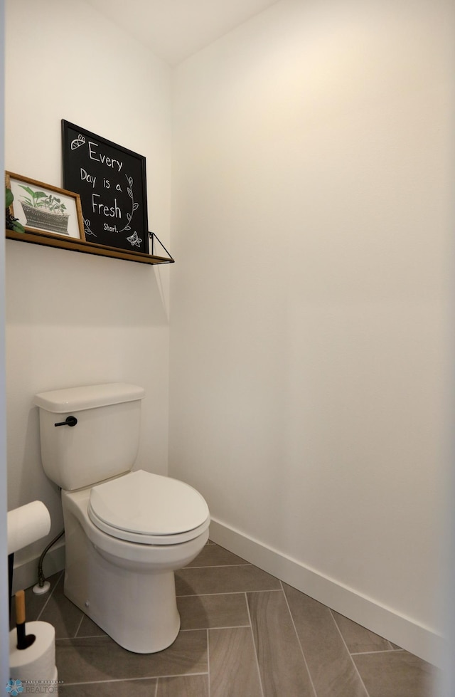 bathroom featuring tile patterned floors and toilet