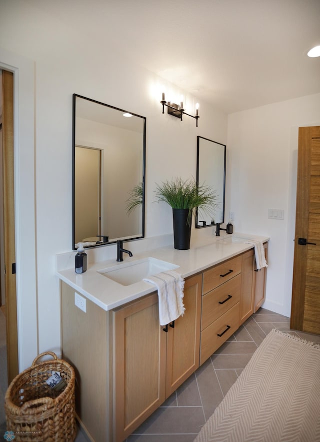 bathroom featuring double vanity and tile patterned floors