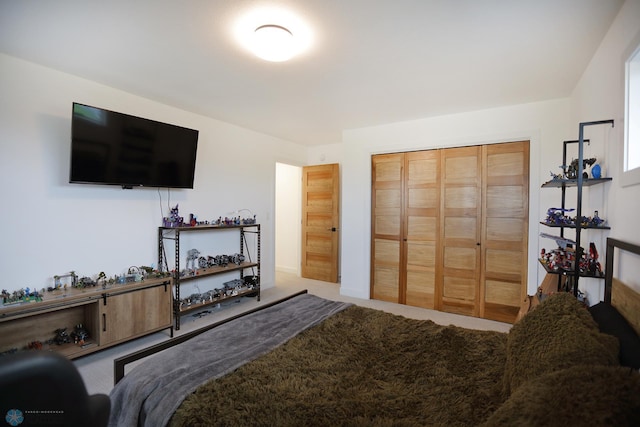 carpeted bedroom with a closet