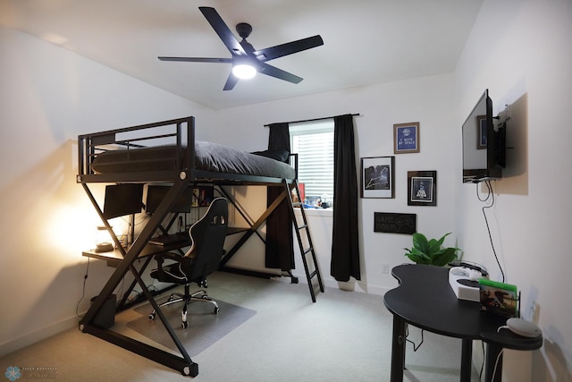 interior space with carpet flooring and ceiling fan