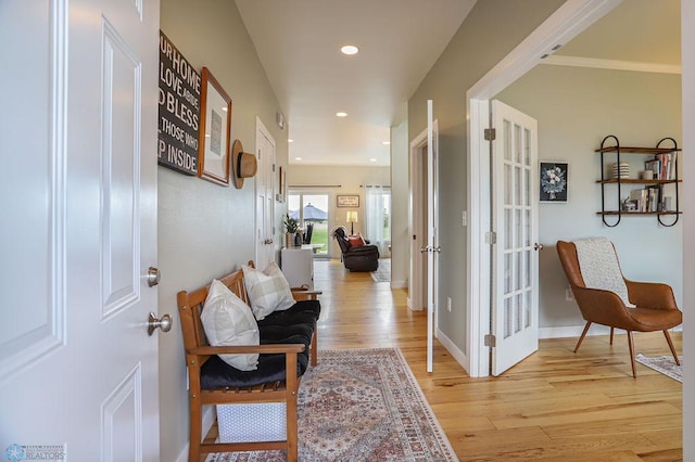 hall with light hardwood / wood-style flooring