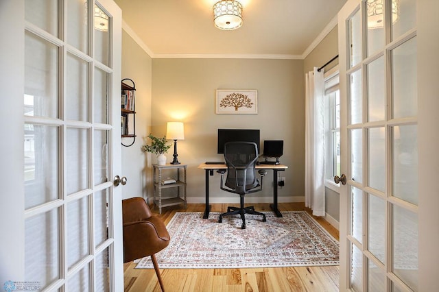 office area with crown molding, french doors, and hardwood / wood-style floors