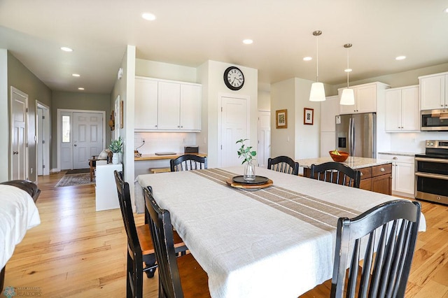 dining room with light wood-type flooring