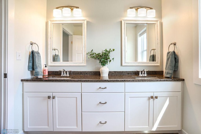 bathroom with dual bowl vanity